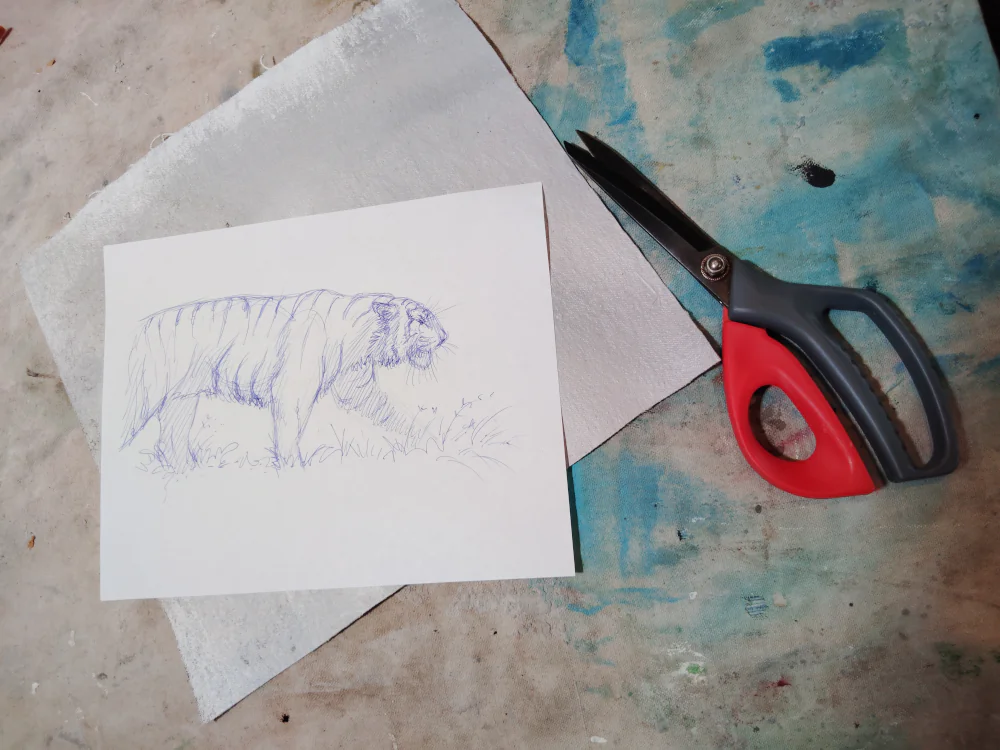 A pencil sketch of a tiger on paper